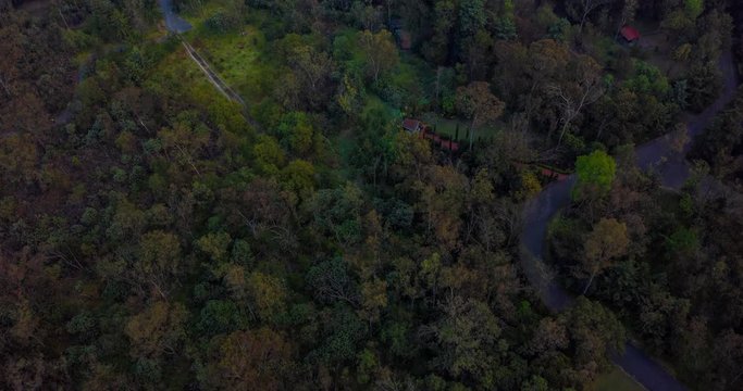 Aerial tilt up hyperlapse of the Tlalpan forest, the Lienzo Charro del Pedregal in the south of Mexico City at the morning