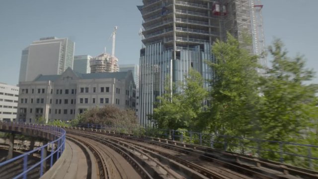 POV shot of DLR train riding in Canary Wharf. Financial district of London, England, UK.