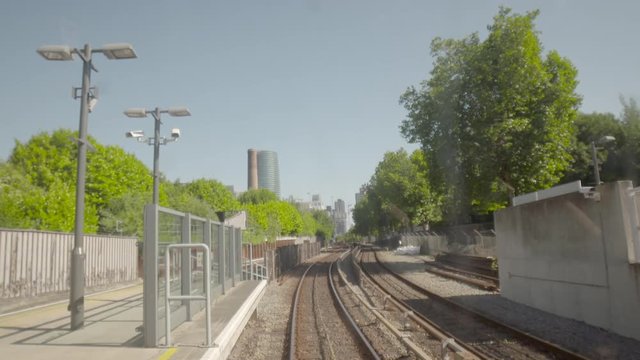 POV shot of DLR train ridingthe station in Lewisham and Greenwich. Districts of London, England, UK.