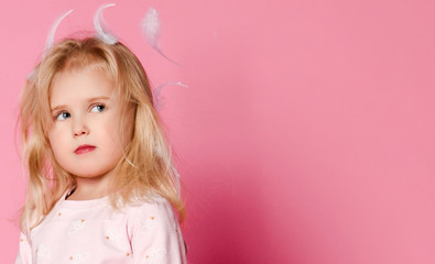 little girl blonde with feathers in her hair