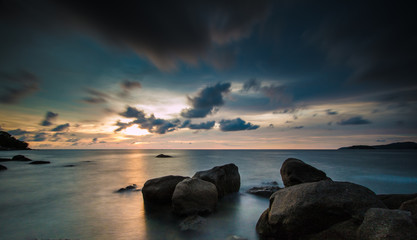 Fototapeta na wymiar Long exposure shot.Sea scape with stone beach at sunset,Motion blur,slow shutter speed.