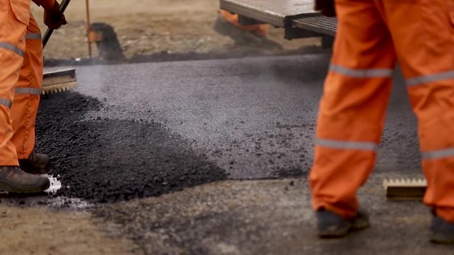 Trimming new rad. Asphalt on the road. Bitumen