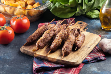 Grilled balkan cevapcici or  kebab on skewers