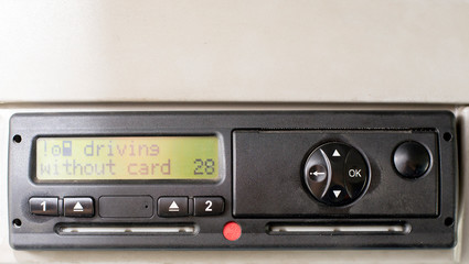 Digital tachograph display reads DRIVING WITHOUT CARD. No inserted card in the device. Insert the...