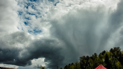 contrasting dark clouds against a blue sky