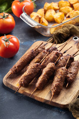 Grilled balkan cevapcici or  kebab on skewers