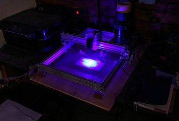 Laser engraving marking instrument in the dark.