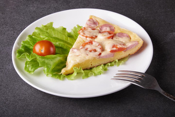 fresh pizza with hard cheese and cherry tomatoes and herbs