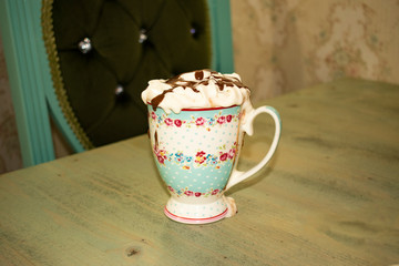 Iced coffee with toasted marshmallow and chocolate syrup Cold coffee drink frappe (frappuccino)...