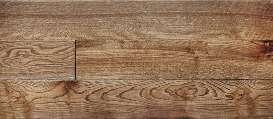 Fototapeta premium parquet from solid wood. sample of parquet. texture or background. wood texture. board. painted with natural oil. wax. mastic. imitation of valuable species of wood.