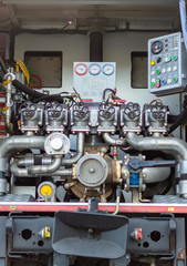 Close up on mechanics of a fire truck. Industrial, valves, mechanics.