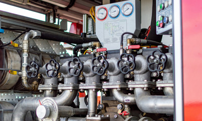 Close up on mechanics of a fire truck. Industrial, valves, mechanics.
