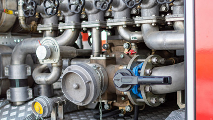 Close up on mechanics of a fire truck. Industrial, valves, mechanics.