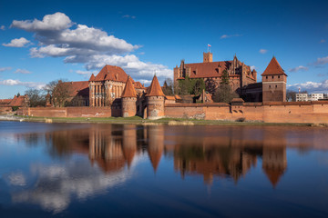 Teutonic castle and its reflection in Nogat river in Malbork, Pomorskie, Poland