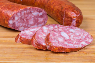 Pork bologna sausage slices against of the rest is sausage © An-T