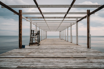 Wooden pier and sea, perspective, corridor view with no people
