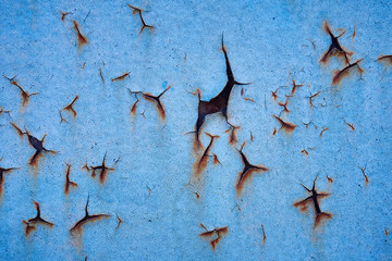 old painted rusty metal surface with corrosion traces for texture or background