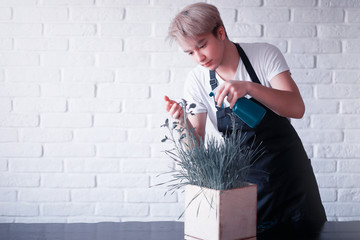 Young Asian boy takes care of plants