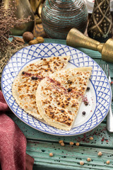 flat bread qutab on blue wooden table traditional Azerbaijani cuisine