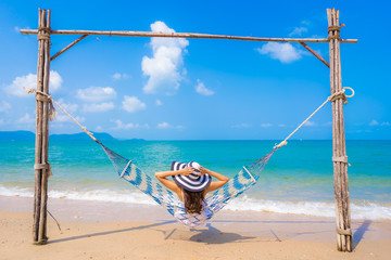 Portrait beautiful young asian woman happy smile leisure on the beach sea and ocean