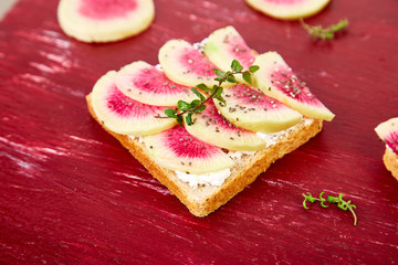 Healthy breakfast toasts from sliced watermelon radish