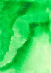 Abstract watercolor background. Bright green gradient watercolor background with interesting blur. Handwork on paper with paints. Blurred, vertical, macro.