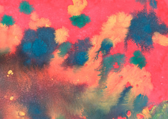 Abstract watercolor background.Red with yellow and blue gradient watercolor background with stains and interesting divorces. Handmade on paper with paints. Blurred, horizontal, macro.
