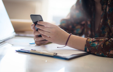 Checking her messages.