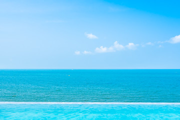 Fototapeta na wymiar Beautiful landscape of sea ocean with outdoor swimming pool on white cloud