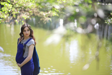 Pregnant woman on a walk in the park