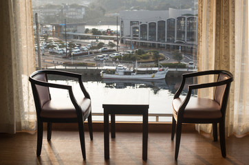 Classical hotel room interior of a table and chairs