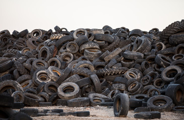 Old tyres polluting the nature. Environmental pollution.