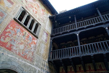 Medieval wooden gallery of the second floor in an old stone castle