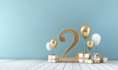 Number 2 party celebration room with gold and white balloons and presents. 