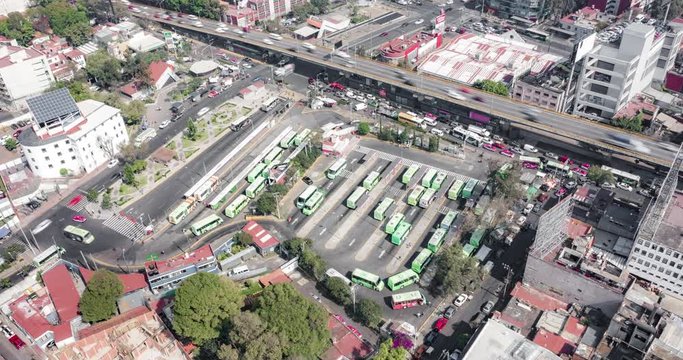 Aerial orbit hyeprlapse of the big bus stop of Mixcoac in Mexico City