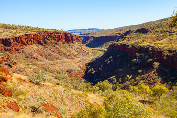 Great Northern Highway winding through Munjina Gorge in the Hamersley Ranges, near Karijini National Park in the Pilbara region of Western Australia, Australia.