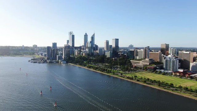 Aerial 4K panoramic drone footage of the city of Perth, Western Australia, flying over Swan River. Langley park in the foreground. Perth is the capital city of WA.
