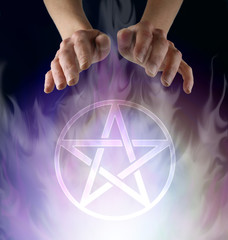Wiccan Pentacle Ceremony - witch's hands hovering above a transparent Pentacle symbol floating in...