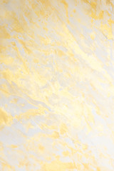 Abstract golden textured hand painted background closeup