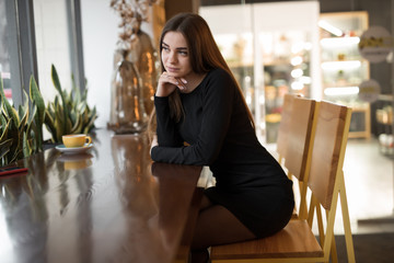 Portrait of pretty woman in cafe