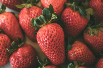 Heap of fresh and organic strawberries as background. Close up view of ripe strawberries. 