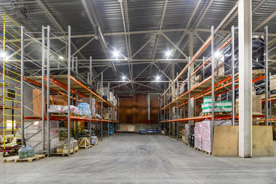 Long shelves with a variety of boxes and containers.