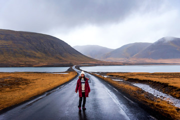 Traveler on Icelandic road in Snaefellsnes peninsula of Iceland