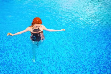 Woman swimming in the pool.