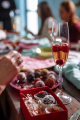little cakes in a bowl, a glass of wine with cherries