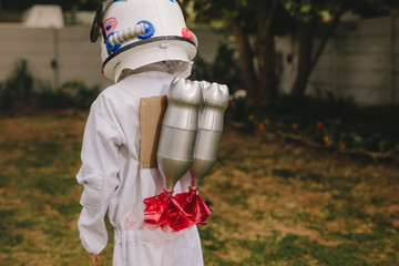 Boy dressed as astronaut with a toy jetpack © Jacob Lund