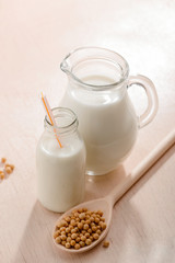 Bottle and jug of milk
