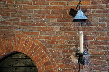 Candle on castle wall for illuminate Candle in the church.