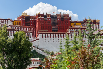 View on main part of Potala Palace (Lhasa, Tibet, China) with blue sky and a big cloud in the...