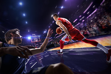 Basketball player make block shot in jump. around Arena with blue light spot